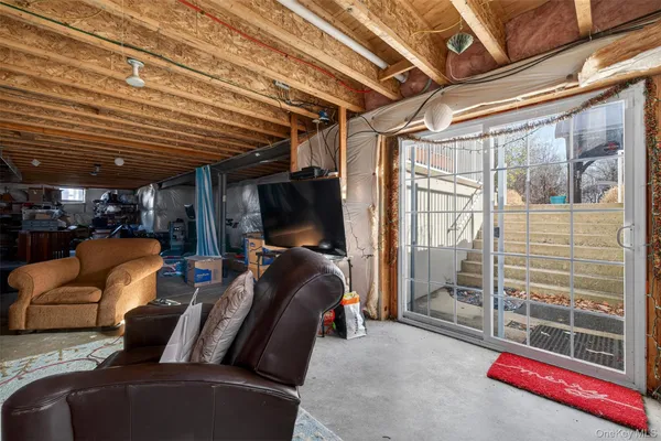 a view of a porch with a table and chairs