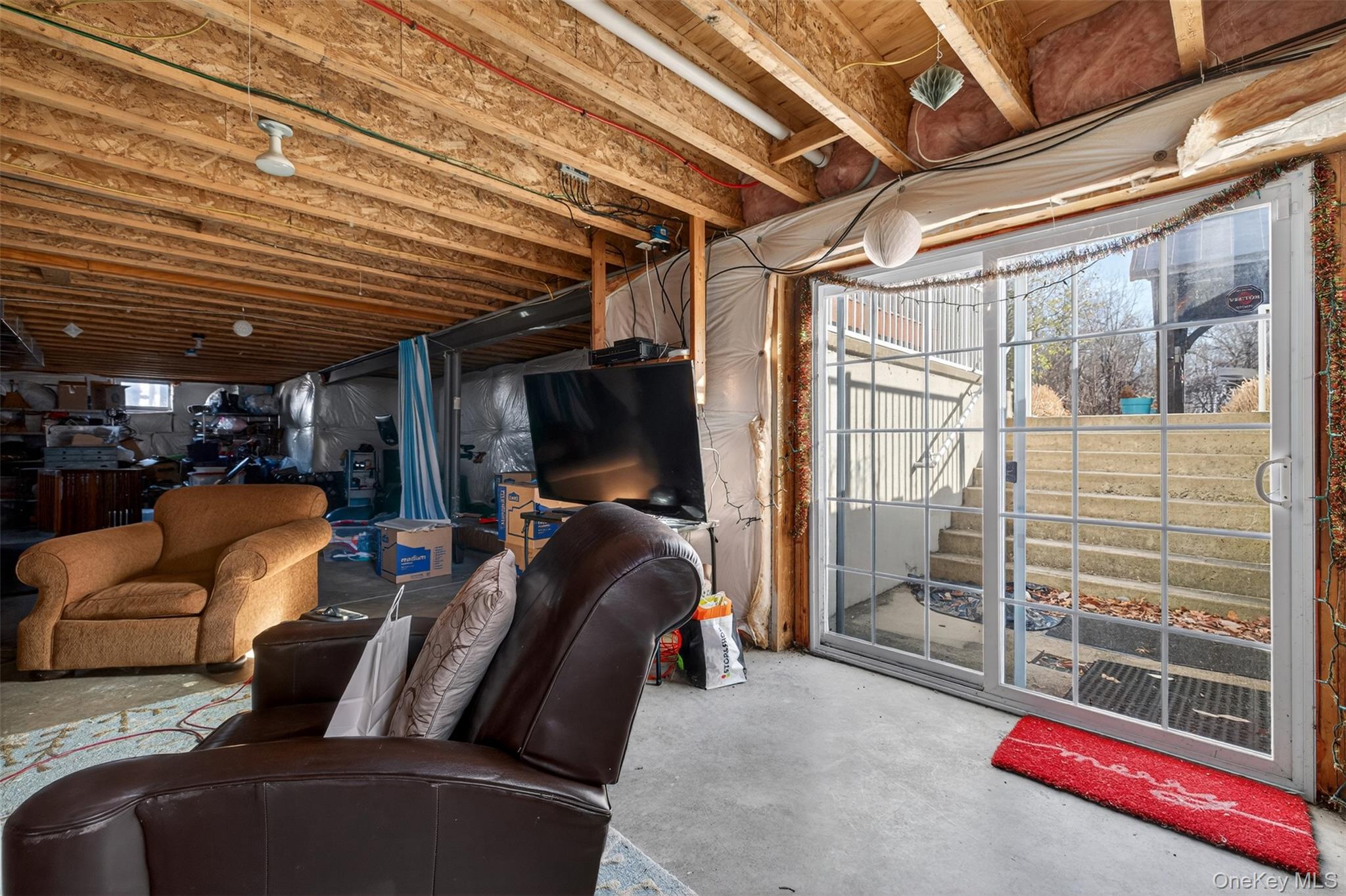 102 Luthien Forrest Road Rock Tavern, NY 12575 - Photo 42 of 45 a living room with furniture a flat screen tv and a table