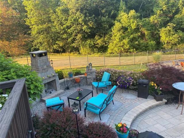 a backyard of a house with outdoor seating