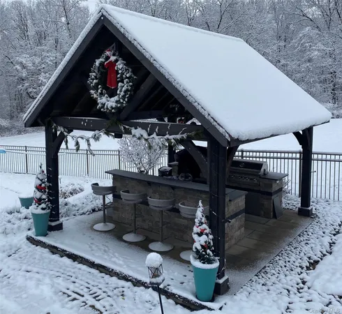 a front view of a house with swimming pool