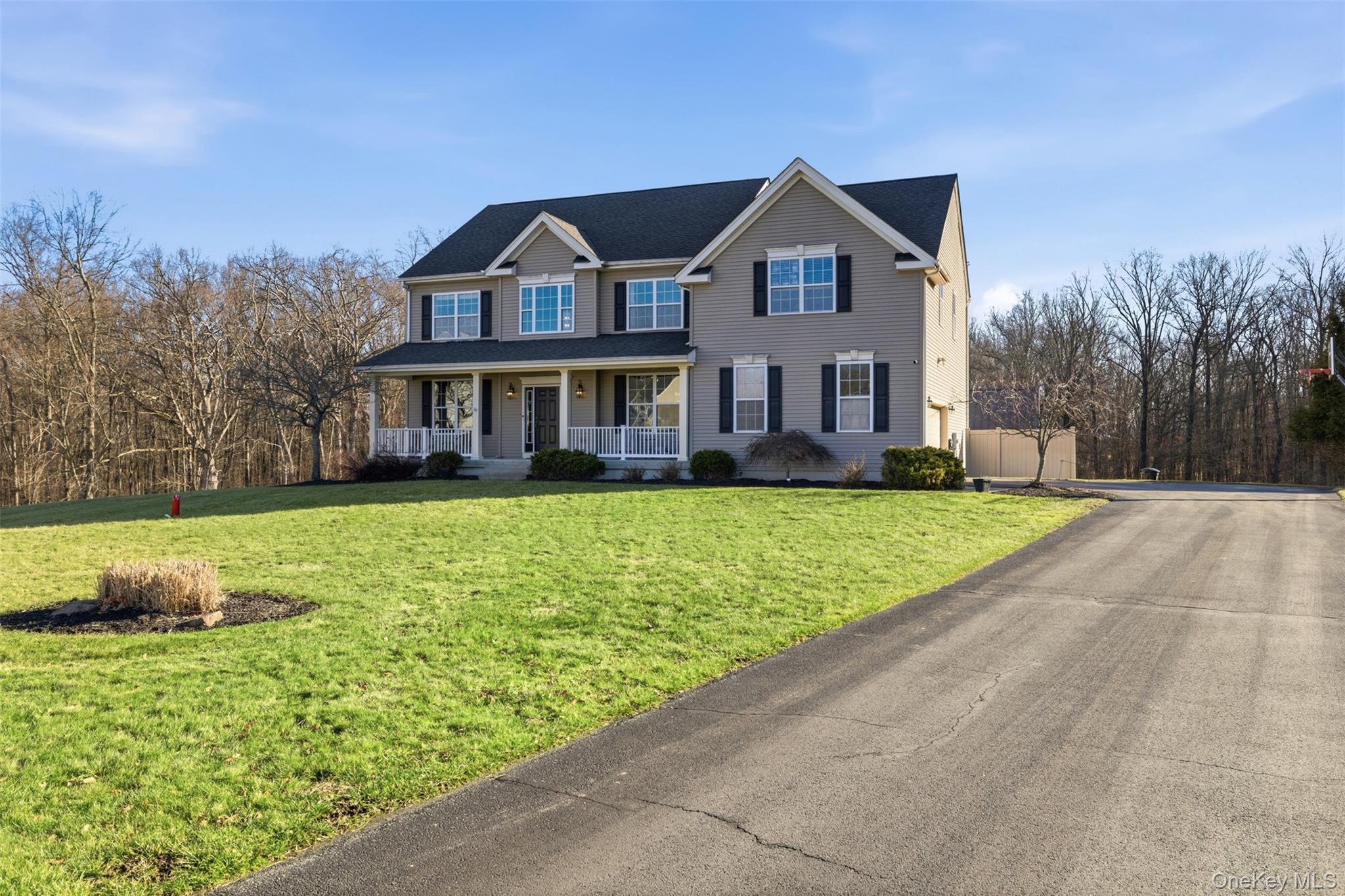 102 Luthien Forrest Road Rock Tavern, NY 12575 - Photo 10 of 45 a front view of a house with a yard and potted plants