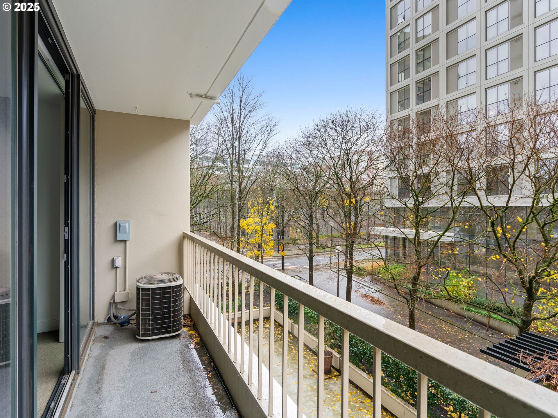 255 Southwest Harrison Street, Unit 3C Portland, OR 97201 - Photo 21 of 32 a view of balcony with wooden floor and fence