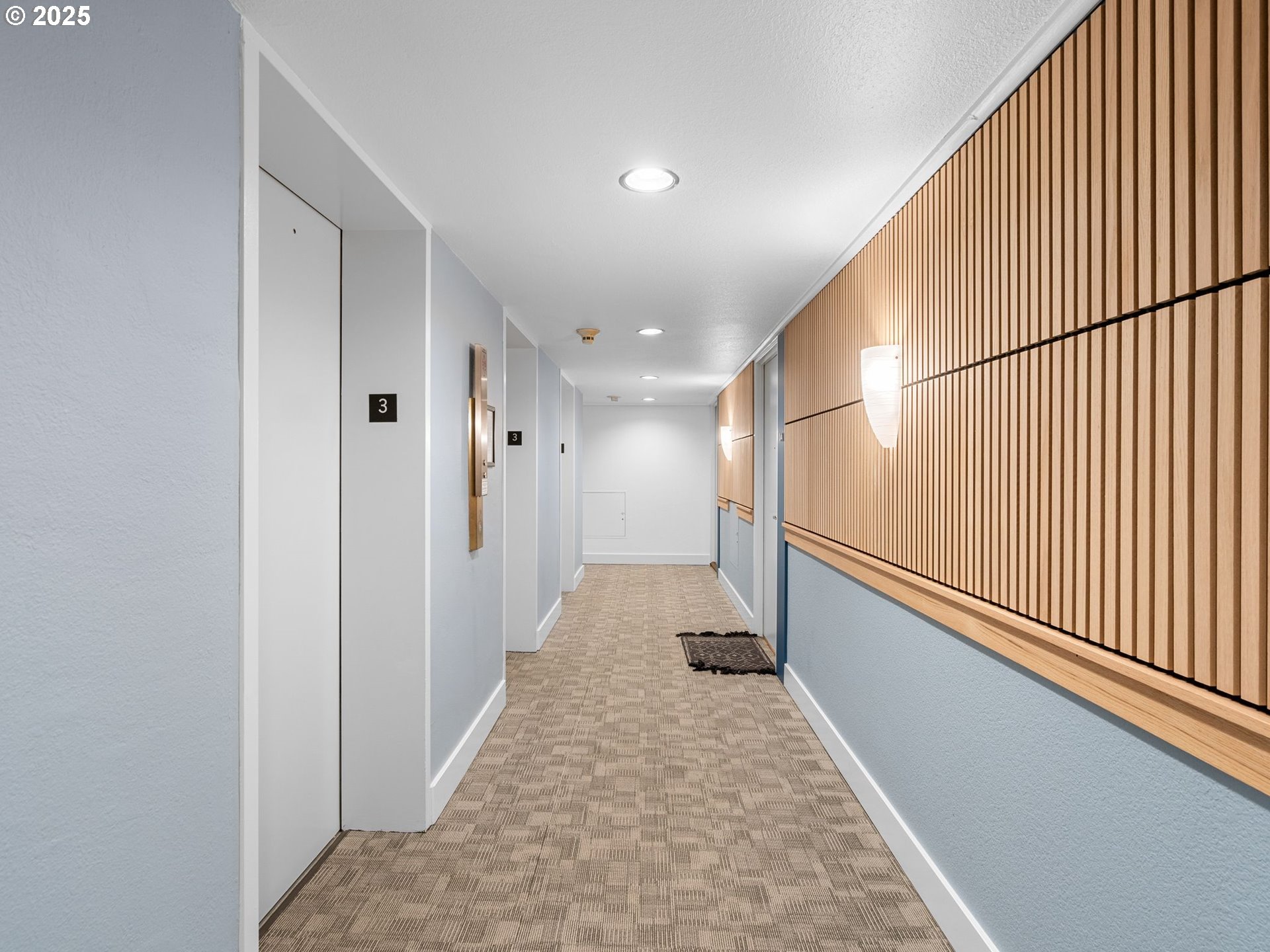 255 Southwest Harrison Street, Unit 3C Portland, OR 97201 - Photo 5 of 32 a view of a hallway with wooden floor