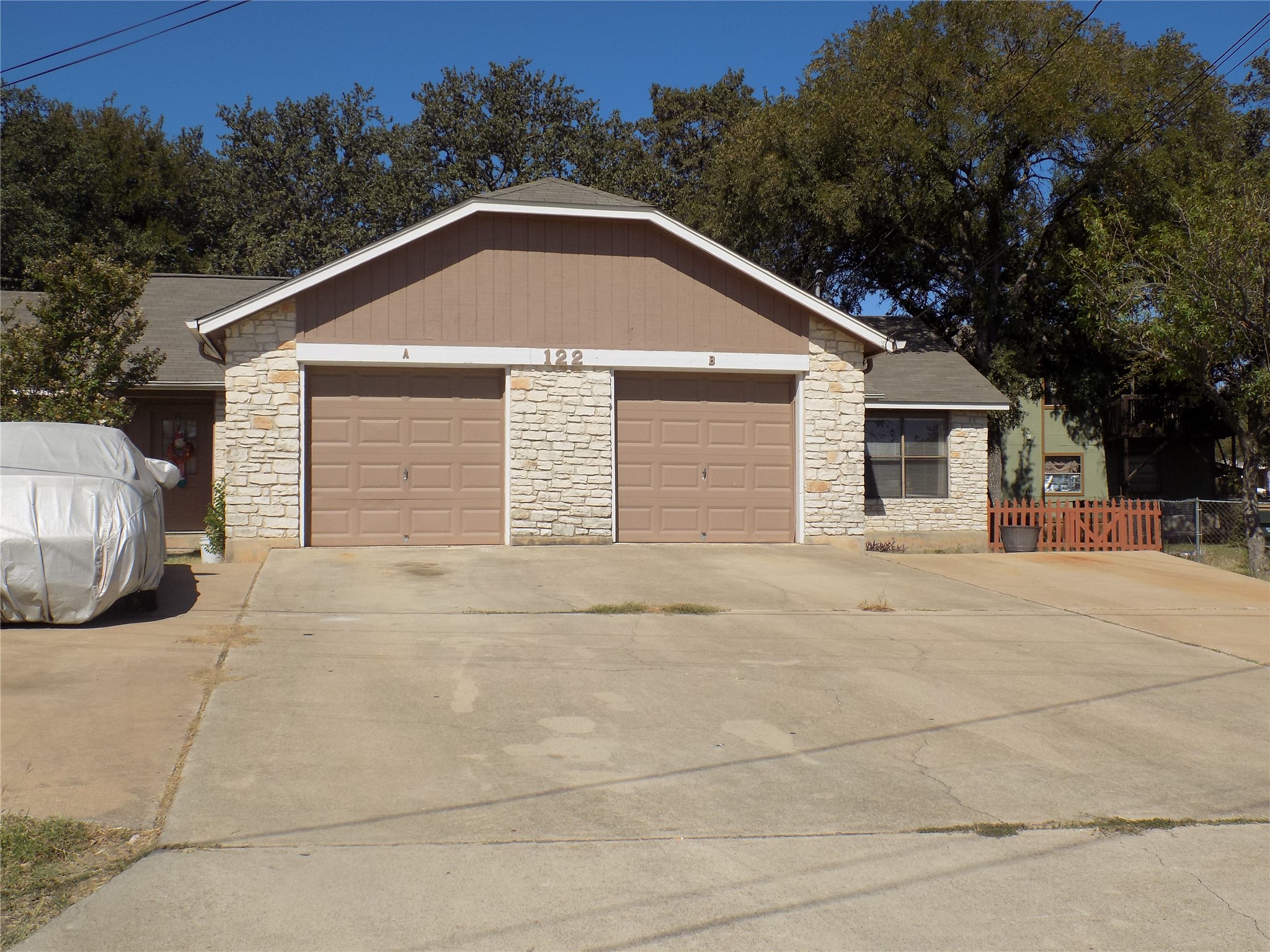 a front view of a house with a garage