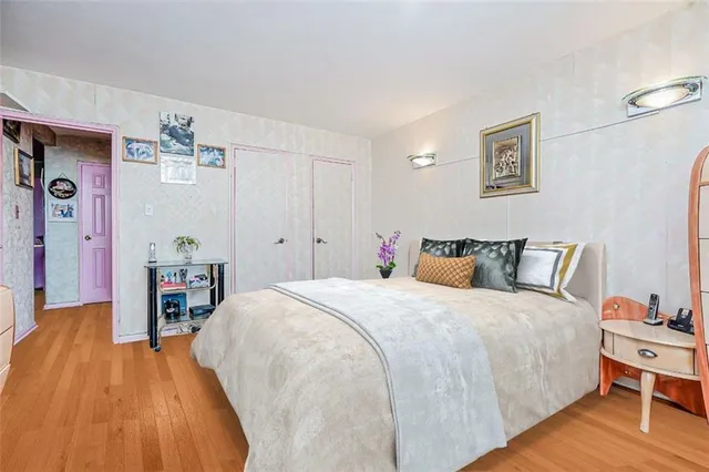 a bed room with a bed and a table