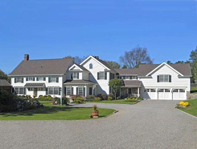 286 Millstone Road Wilton, CT 06897 - Photo 1 of 1 a front view of a house with a yard