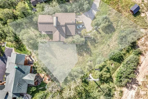an aerial view of residential house with outdoor space