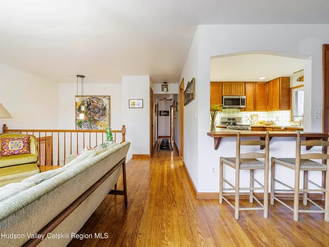 a dining room with furniture and wooden floor