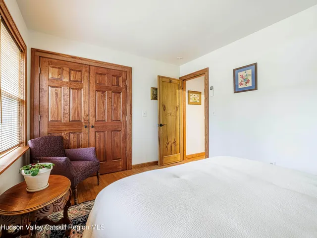 a bedroom with a bed and a table