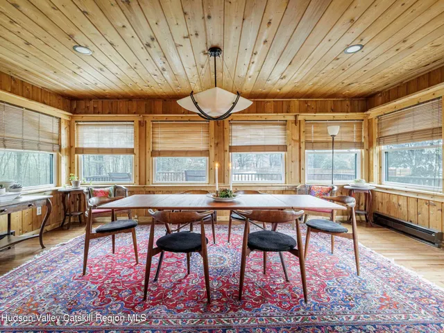 a room with lots of furniture and windows