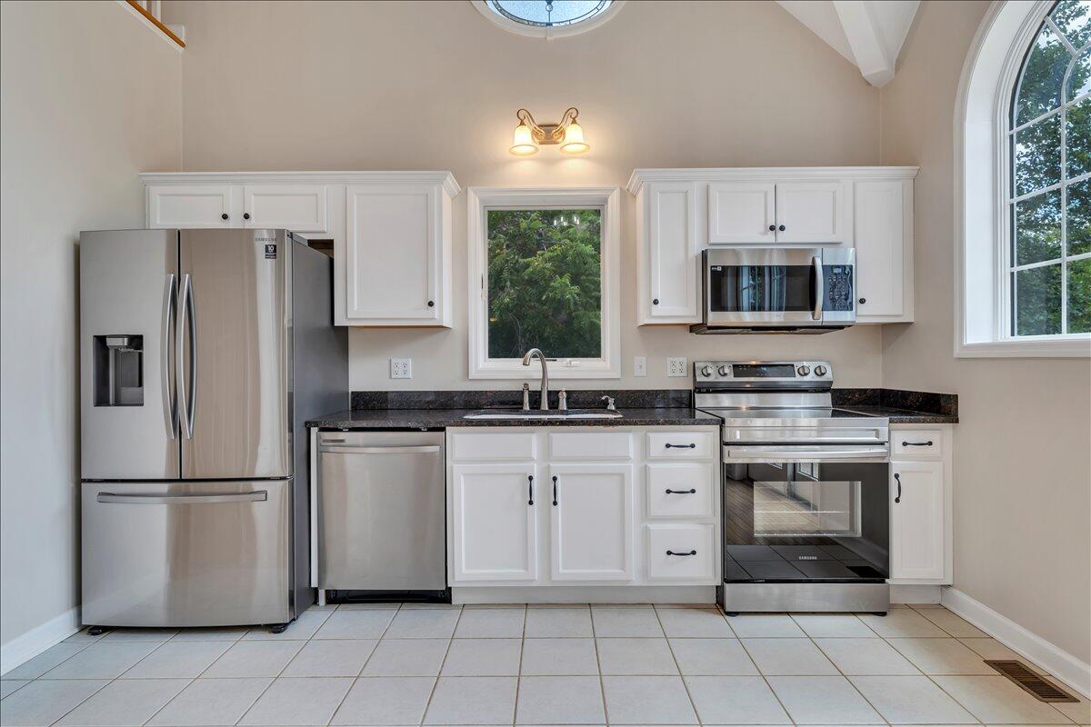 2011 Deep Woods Road Hardy, VA 24101 - Photo 12 of 94 a kitchen with cabinets stainless steel appliances and a window