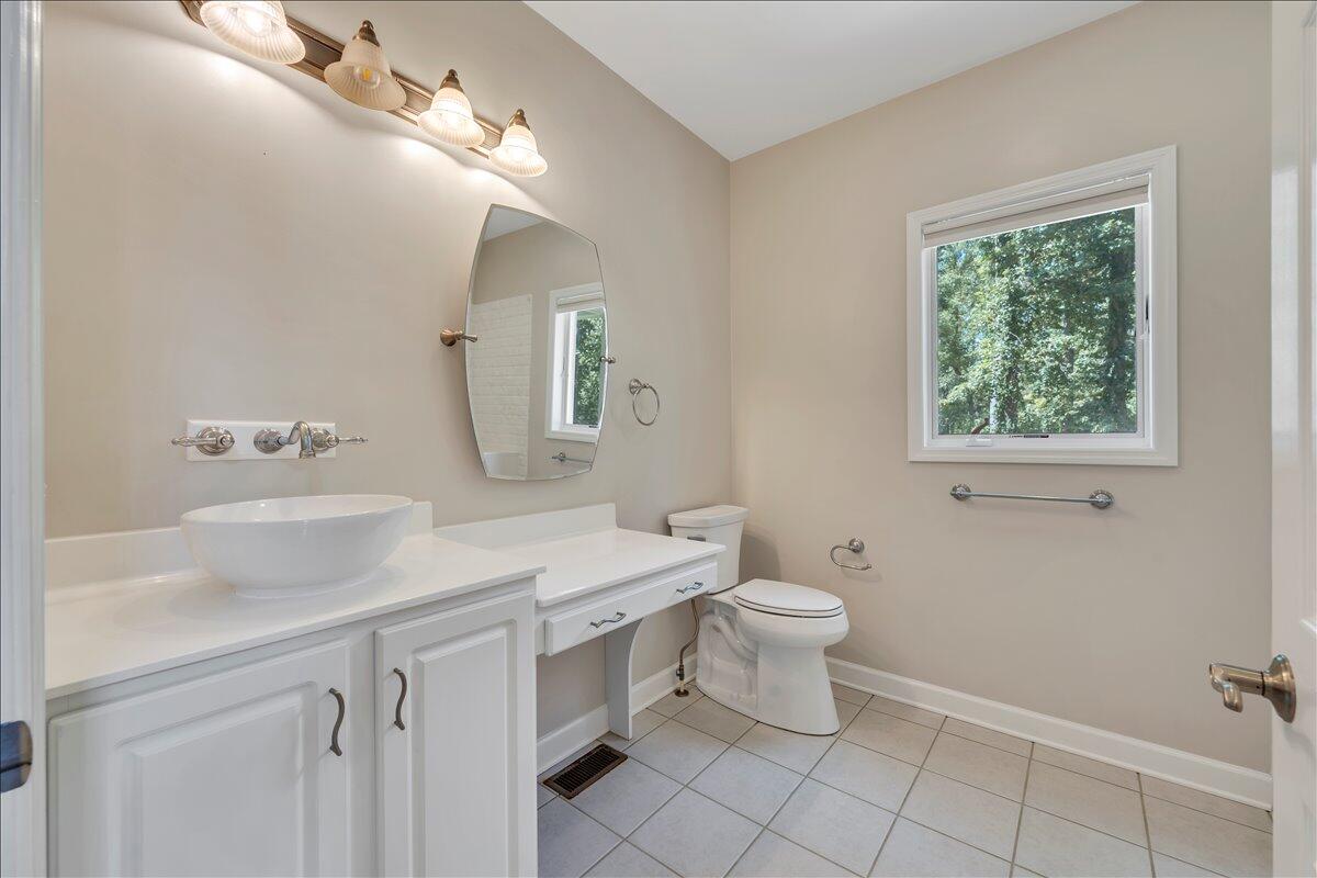 2011 Deep Woods Road Hardy, VA 24101 - Photo 20 of 94 a bathroom with a sink toilet and a mirror