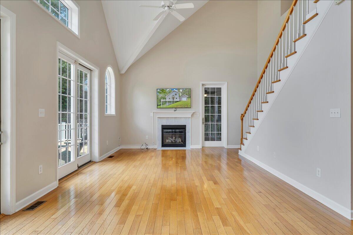 2011 Deep Woods Road Hardy, VA 24101 - Photo 6 of 94 a view of an empty room with wooden floor fireplace and a window