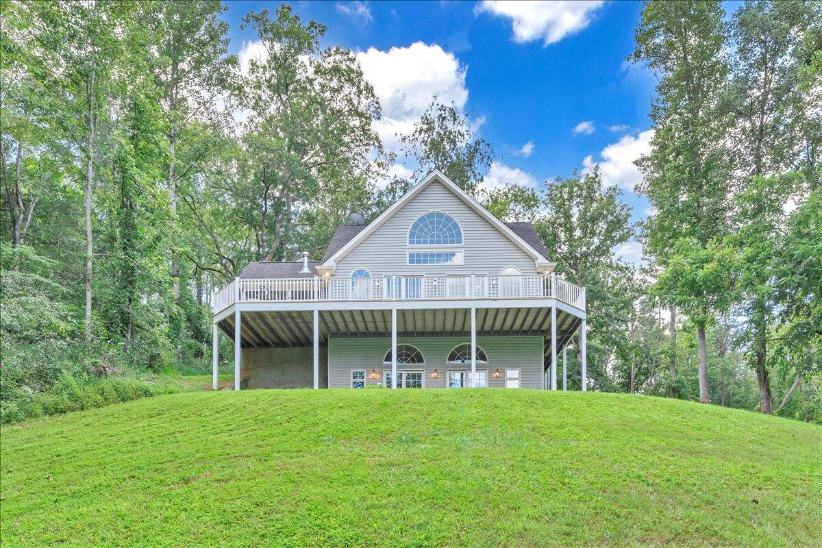 2011 Deep Woods Road Hardy, VA 24101 - Photo 65 of 94 a front view of a house with a yard and balcony