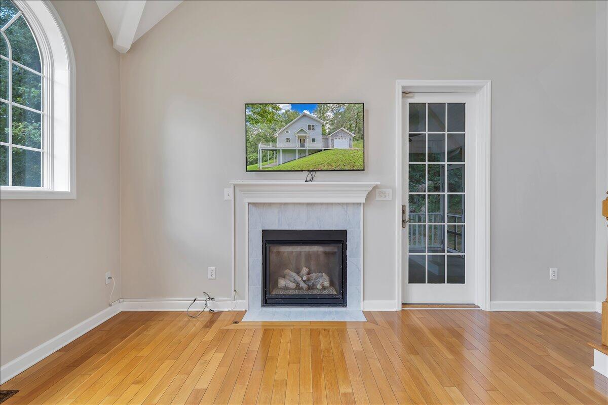 2011 Deep Woods Road Hardy, VA 24101 - Photo 10 of 94 a view of an empty room with a fireplace and a window