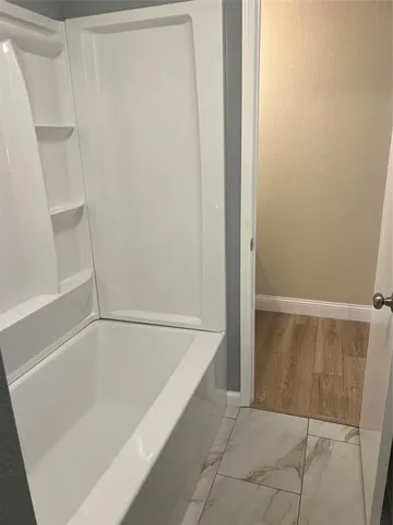 a bathroom with a sink and a tub