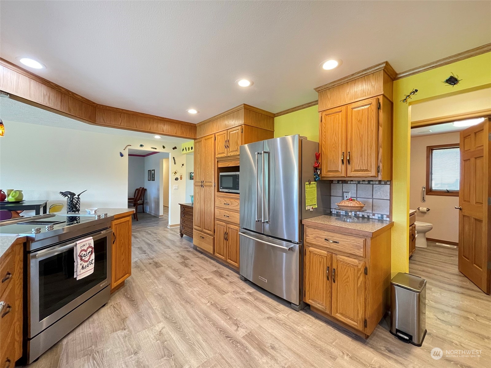 421 Greywolf Road Sequim, WA 98382 - Photo 14 of 40 a kitchen with a refrigerator a stove top oven and a sink