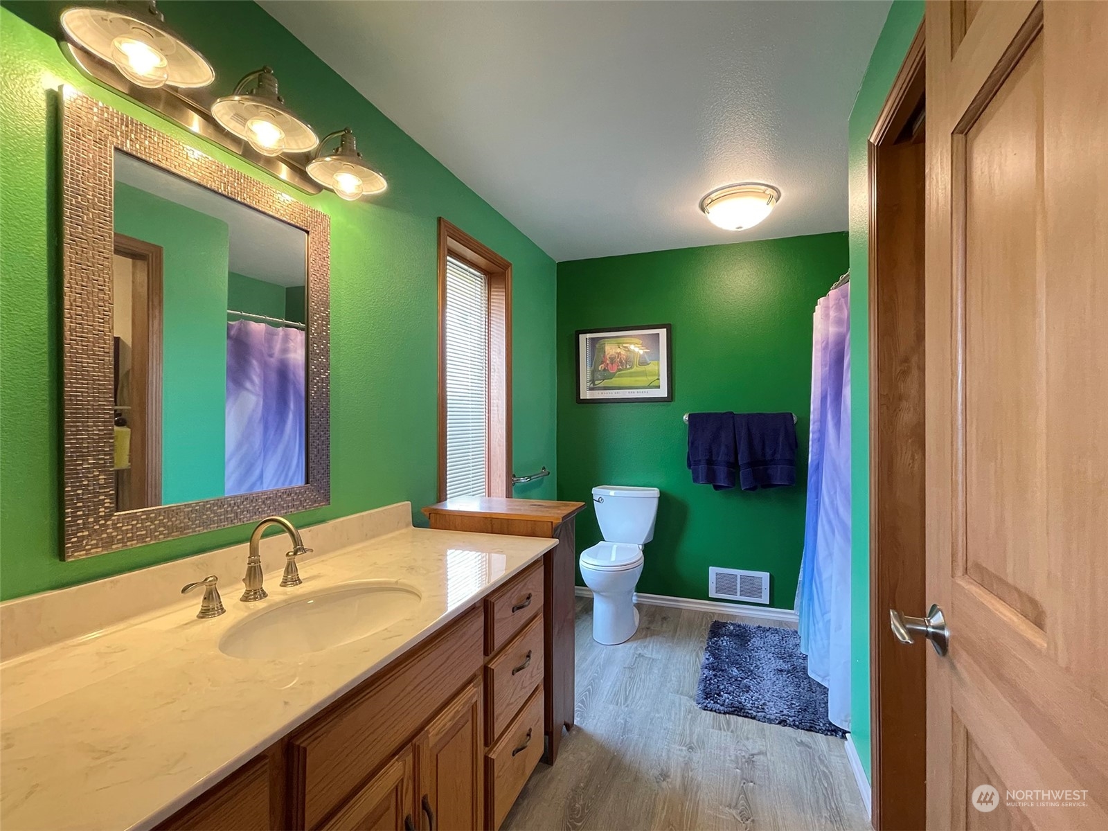 421 Greywolf Road Sequim, WA 98382 - Photo 21 of 40 a bathroom with a sink and a mirror