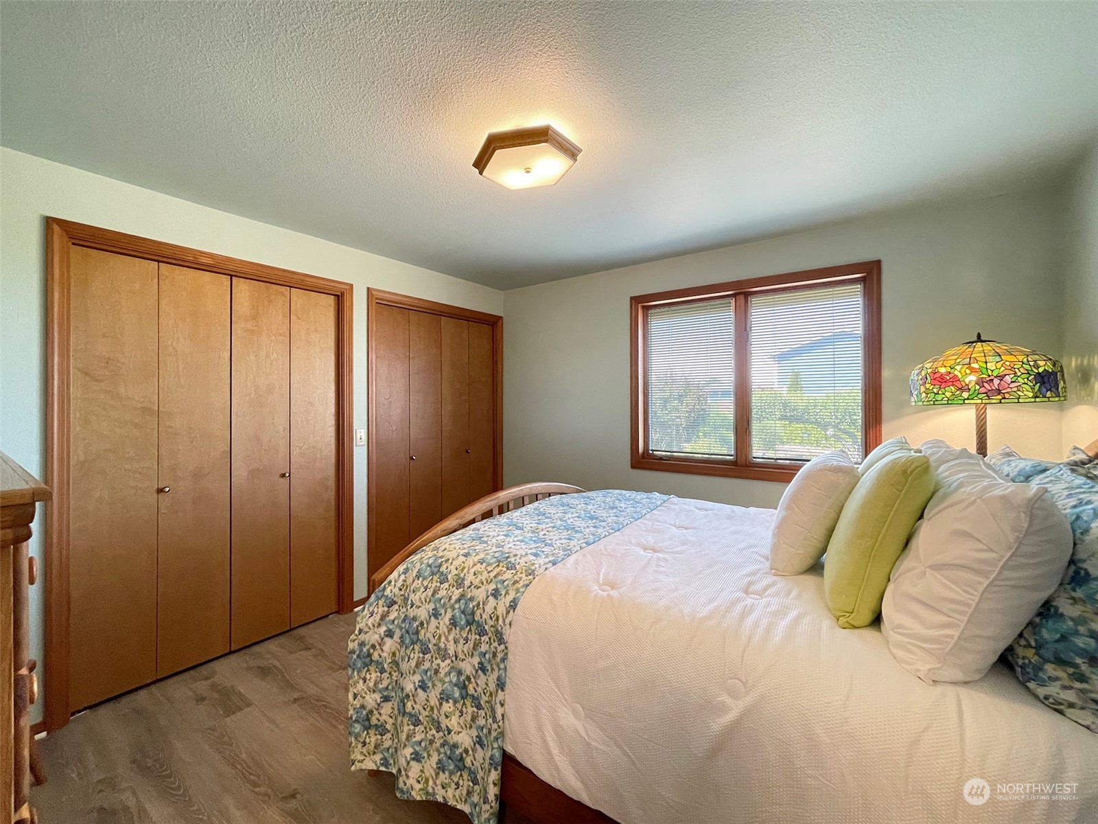421 Greywolf Road Sequim, WA 98382 - Photo 23 of 40 a bedroom with a bed and a window