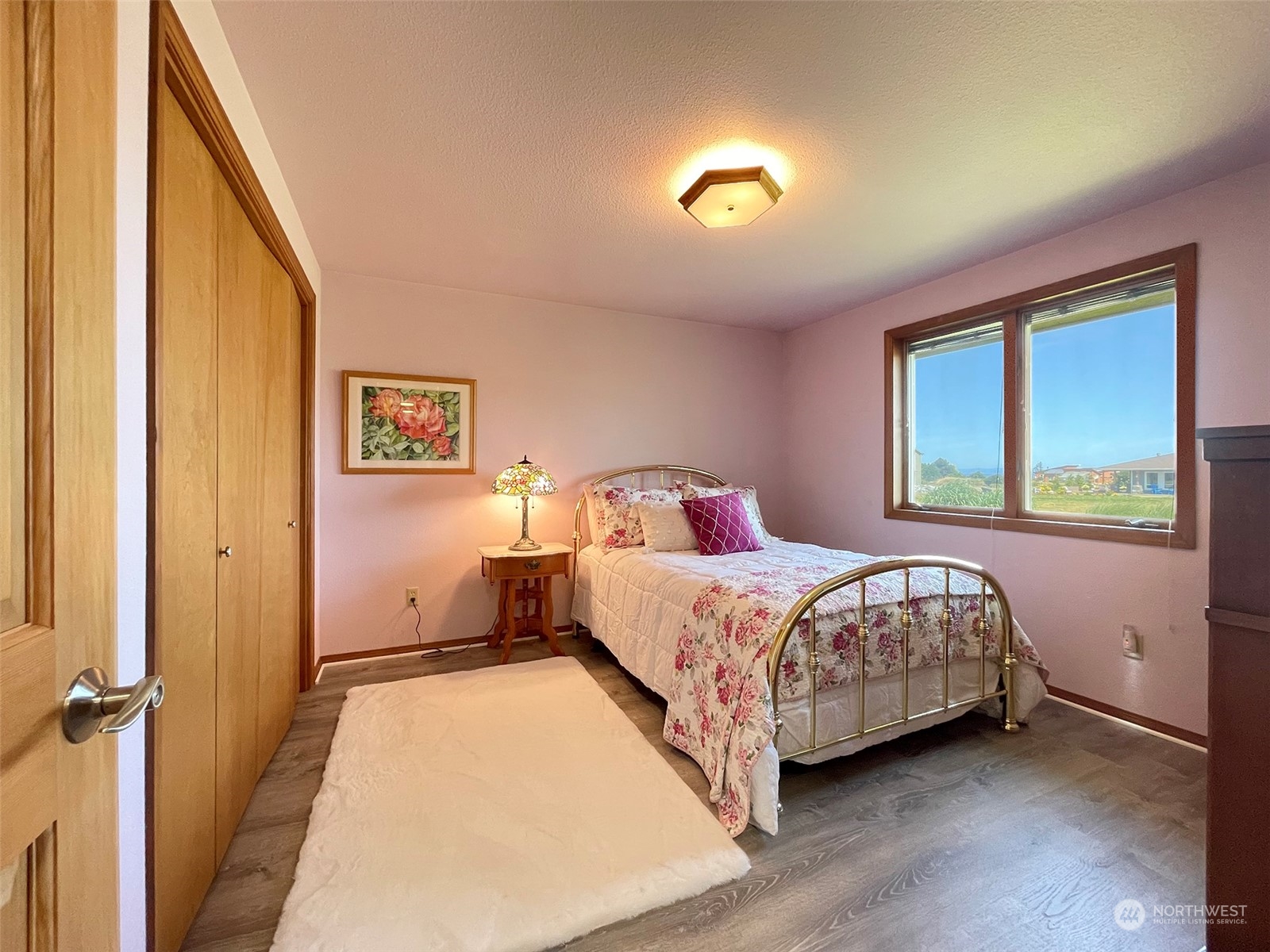421 Greywolf Road Sequim, WA 98382 - Photo 26 of 40 a bedroom with a bed and a window