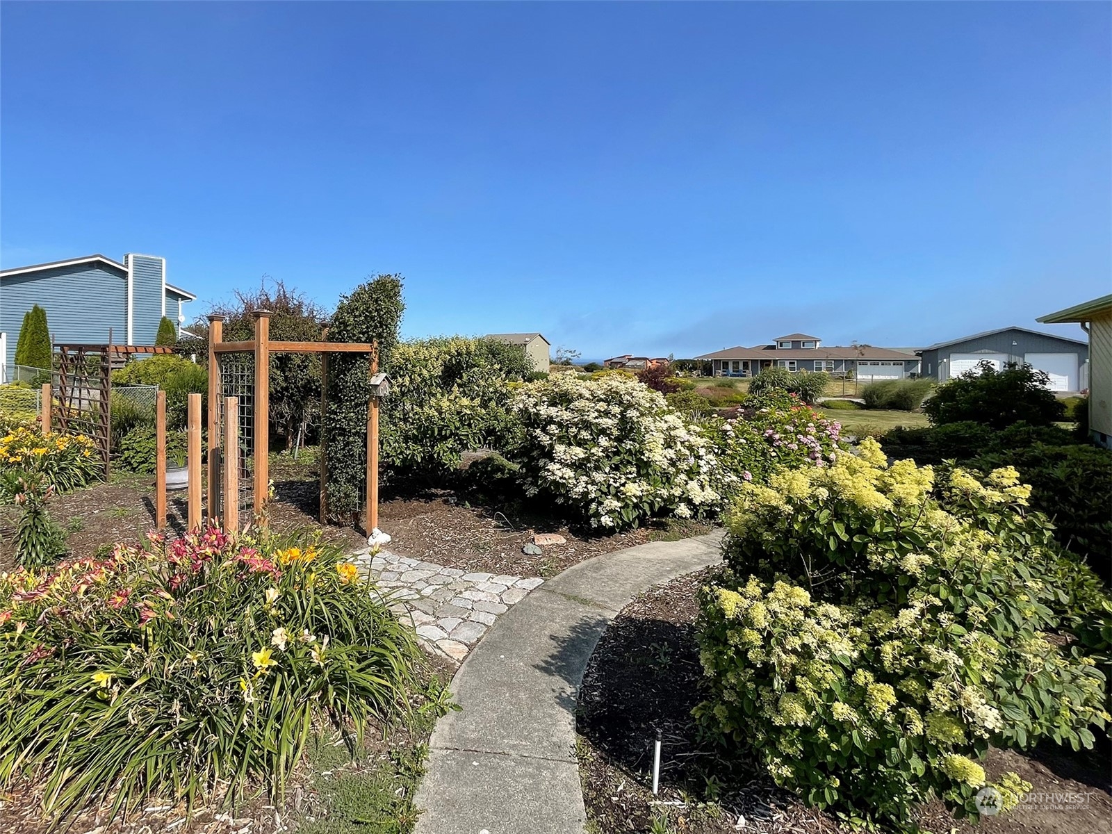 421 Greywolf Road Sequim, WA 98382 - Photo 38 of 40 a view of a pathway with a garden