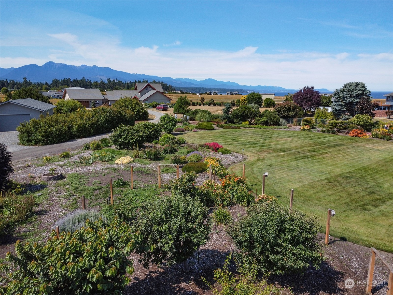 421 Greywolf Road Sequim, WA 98382 - Photo 39 of 40 a view of a lake with a mountain