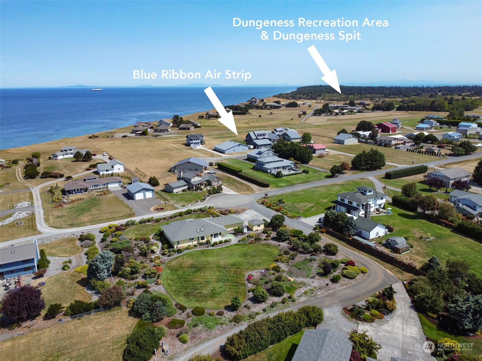 421 Greywolf Road Sequim, WA 98382 - Photo 40 of 40 an aerial view of a house with a ocean view