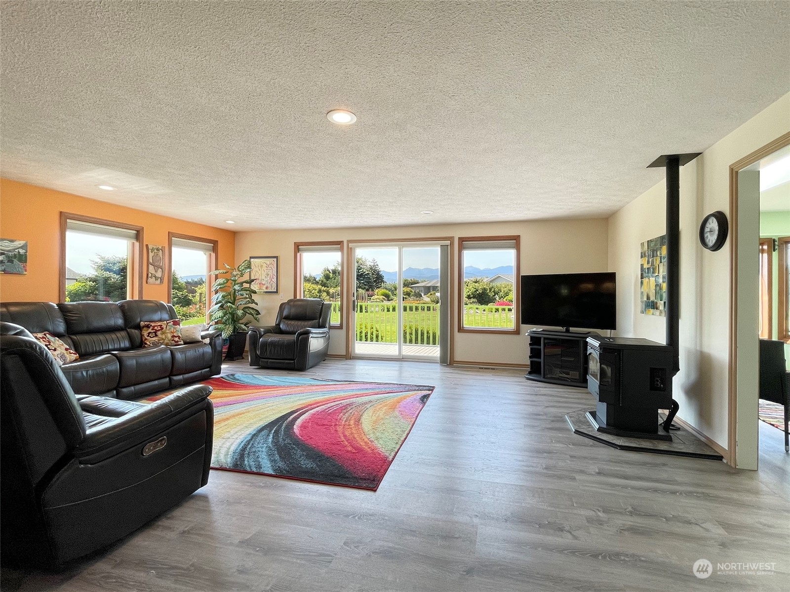 421 Greywolf Road Sequim, WA 98382 - Photo 9 of 40 a living room with furniture flat screen tv and a large window