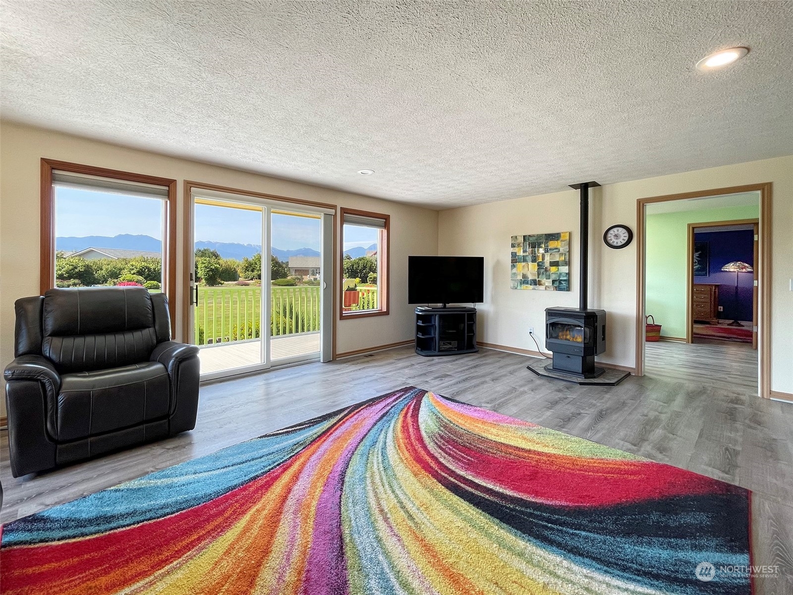 421 Greywolf Road Sequim, WA 98382 - Photo 10 of 40 a living room with furniture and a flat screen tv