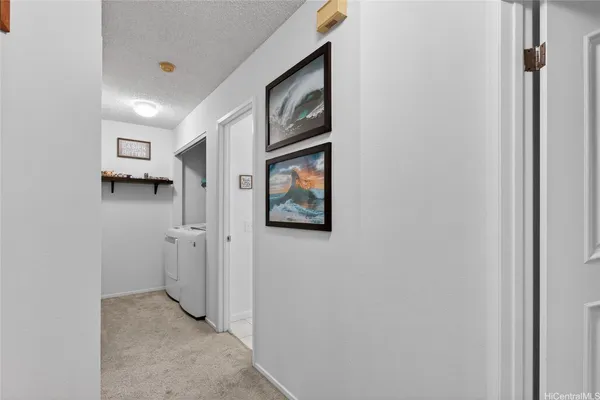 a view of a hallway to rooms