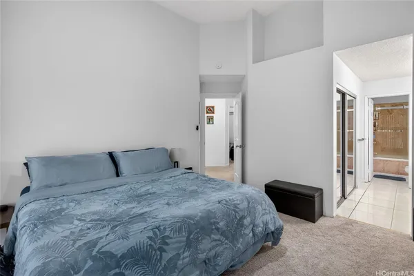 a bedroom with a bed and a table