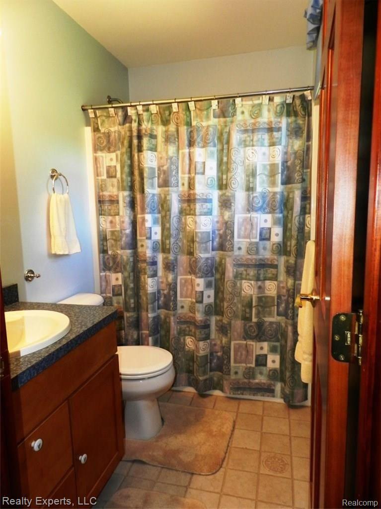 9770 Grames Road Maybee, MI 48159 - Photo 23 of 61 BEDROOM 2 PRIVATE FULL BATH