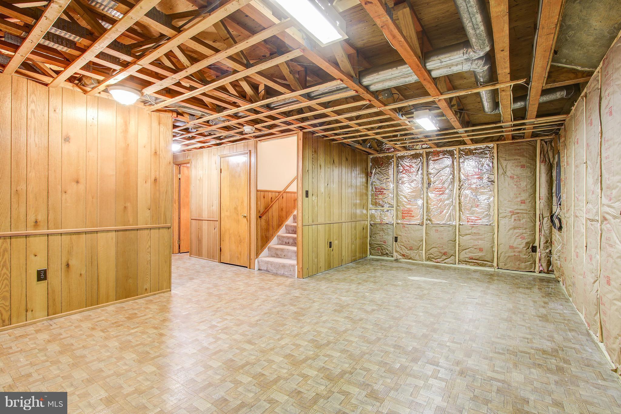 1030 Windrush Lane, Unit 31 Sandy Spring, MD 20860 - Photo 25 of 30 a view of an empty room with wooden walls