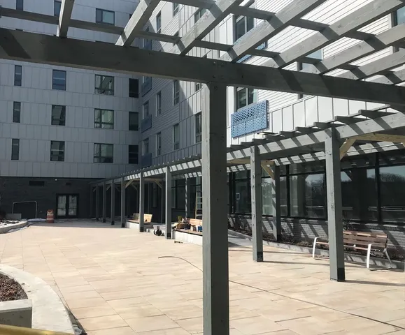a living room with furniture and flat screen tv