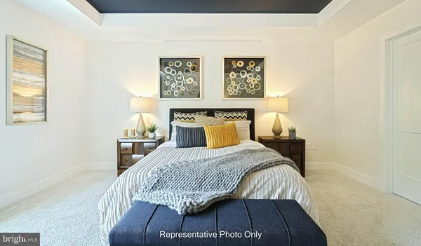 a bedroom with a bed and wall painting