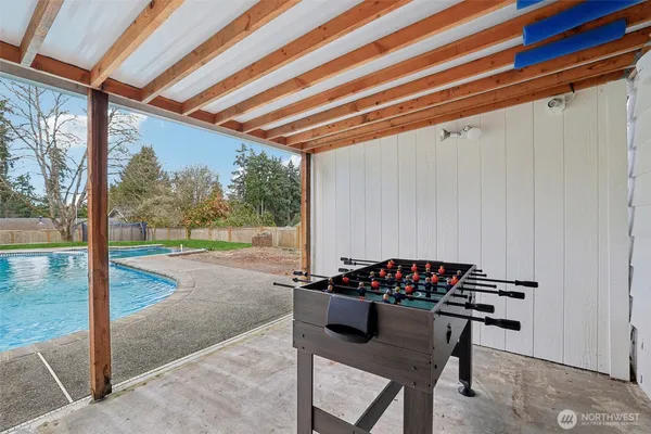 a backyard with table and chairs