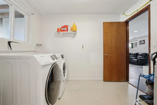 a utility room with dryer and washer