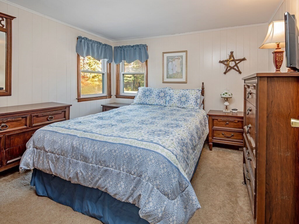 204 New Boston Road Sturbridge, MA 01566 - Photo 13 of 26 a bedroom with a bed and a window