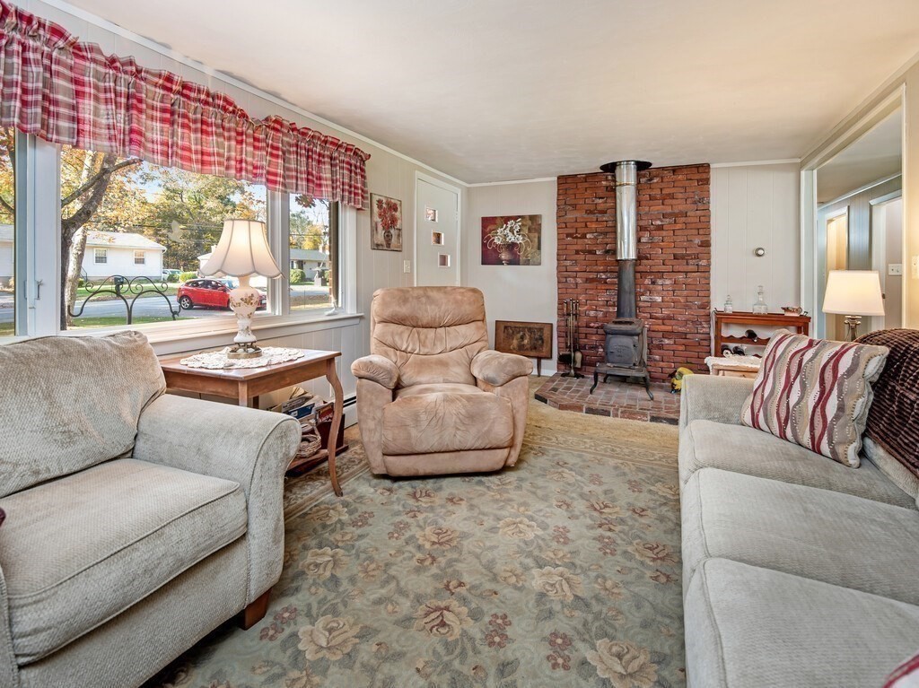 204 New Boston Road Sturbridge, MA 01566 - Photo 10 of 26 a living room with furniture and a large window