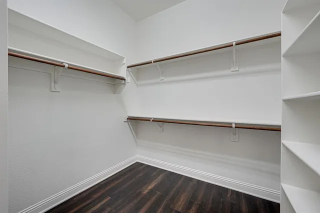 a view of an empty walk in closet