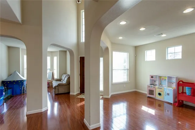 a view of a living room and hardwood floor