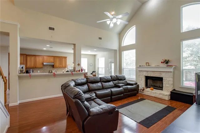 a living room with furniture fireplace and window