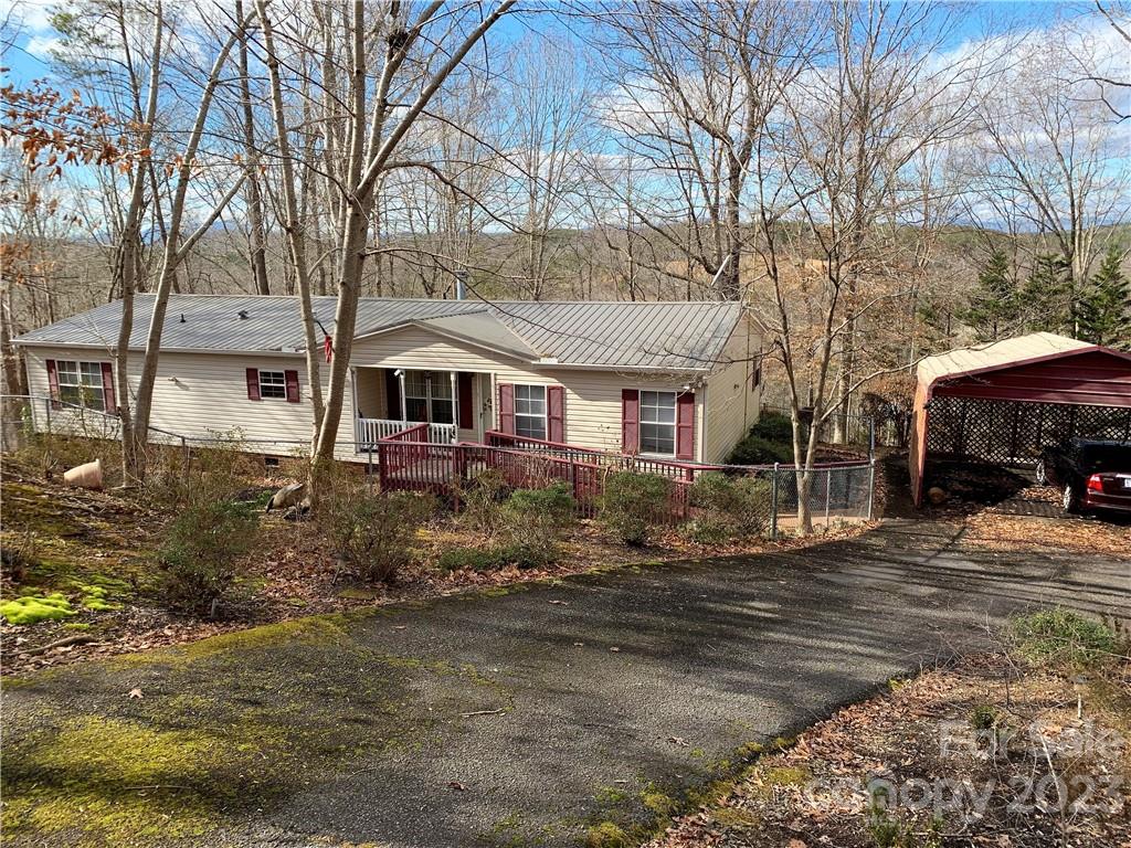 123 Beech Tree Lane Rutherfordton, NC 28139 - Photo 1 of 48 a front view of a house with a yard