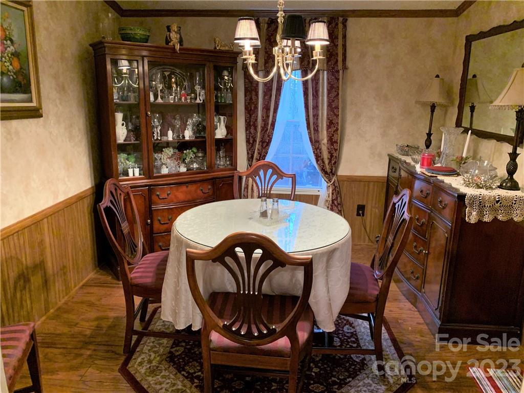 123 Beech Tree Lane Rutherfordton, NC 28139 - Photo 17 of 48 a view of a dining room with furniture window and wooden floor