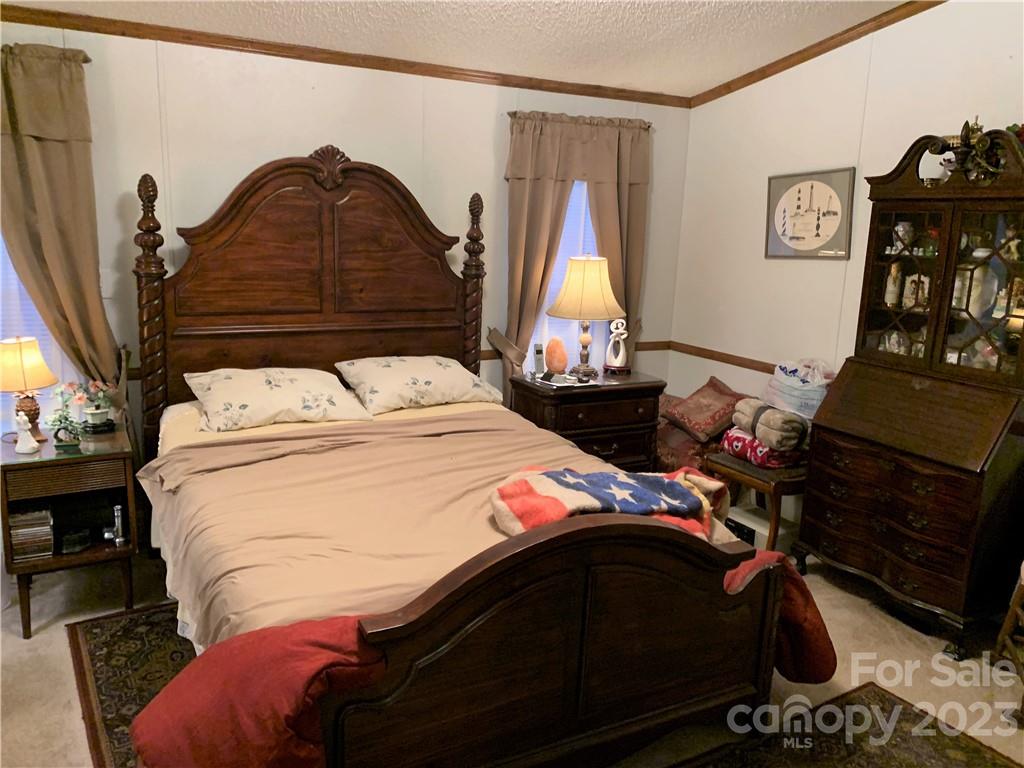 123 Beech Tree Lane Rutherfordton, NC 28139 - Photo 20 of 48 a bedroom with a bed and a closet