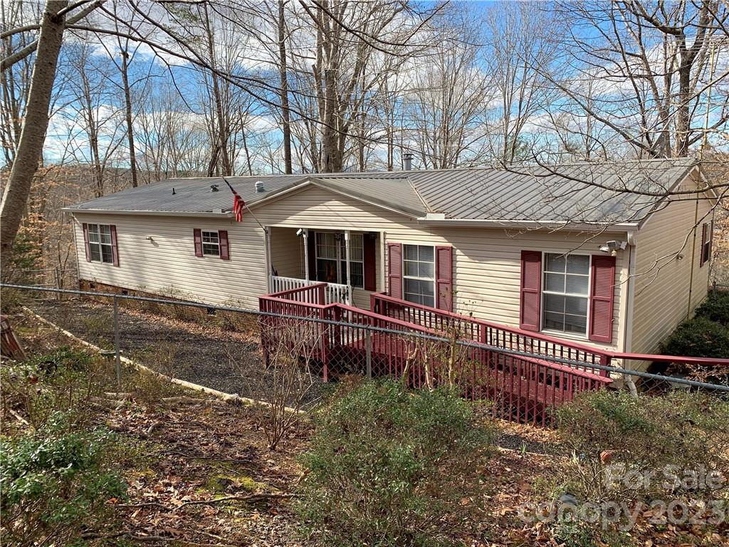 123 Beech Tree Lane Rutherfordton, NC 28139 - Photo 2 of 48 a front view of a house with a yard