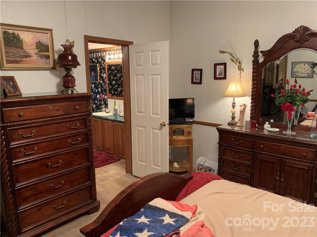 123 Beech Tree Lane Rutherfordton, NC 28139 - Photo 21 of 48 a bed room with a bed and a television