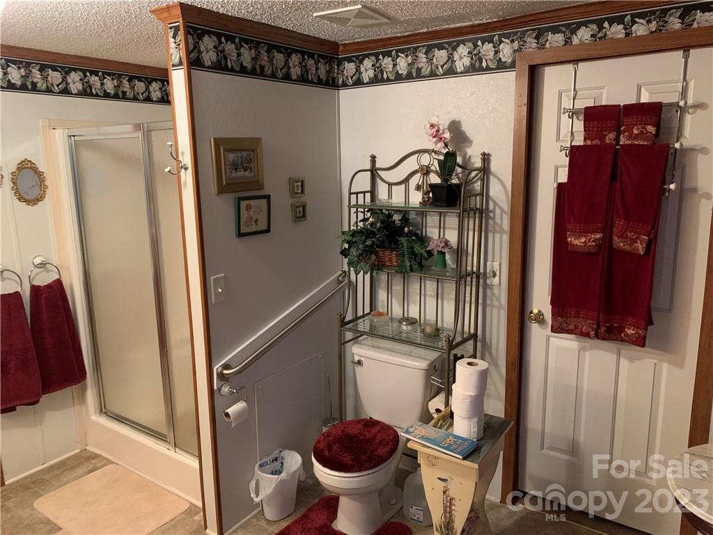 123 Beech Tree Lane Rutherfordton, NC 28139 - Photo 24 of 48 a view of a hallway with a storage and utility room