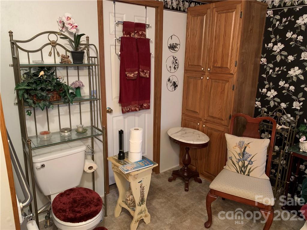 123 Beech Tree Lane Rutherfordton, NC 28139 - Photo 25 of 48 a bathroom with a toilet a sink and mirror