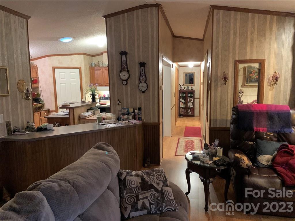123 Beech Tree Lane Rutherfordton, NC 28139 - Photo 26 of 48 a living room with furniture a large window and a fireplace